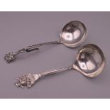 Two Dutch silver caddy spoons. The largest 12 cm long. 40 grammes.