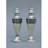 A pair of 925 silver castors. 13.5 cm high. 116.3 grammes.