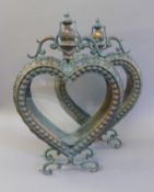 A pair of heart form lanterns. 53 cm high.