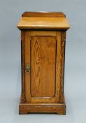 A Victorian Arts and Crafts pitch pine bedside cupboard with original paintwork. 41 cm wide.