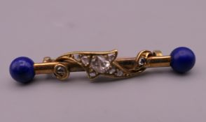 An unmarked gold lapis lazuli and diamond bar brooch. 4.5 cm wide. 3.9 grammes total weight.
