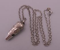 A Victorian small silver whistle with overall decoration, maker's mark of HWA,