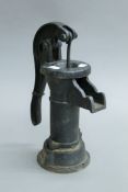 A cast iron water pump. 31.5 cm high.