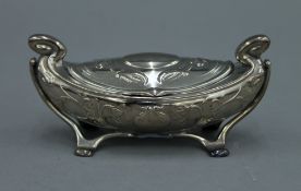 An Art Nouveau silver lidded box decorated with flowers. 12 cm wide. 81.2 grammes.