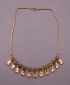 A bi-colour 14 K gold Art Deco style necklace. 38 cm long. 26.1 grammes.