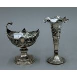 Two Indian silver vases. The largest 16.5 cm high. The smaller 179.6 grammes, the other weighted.