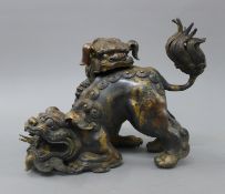 A Chinese bronze dog-of-fo censer. 29 cm long.