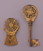 Two verge escapement brooches. The largest 6 cm long.