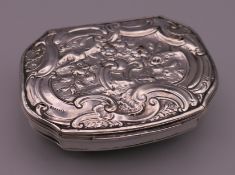 A George III Rococo style silver snuff box, hallmarks for London 1758. 7 cm wide. 60.9 grammes.