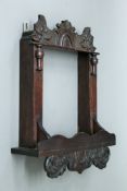 A mahogany wall hanging picture or mirror frame. 33 cm high.