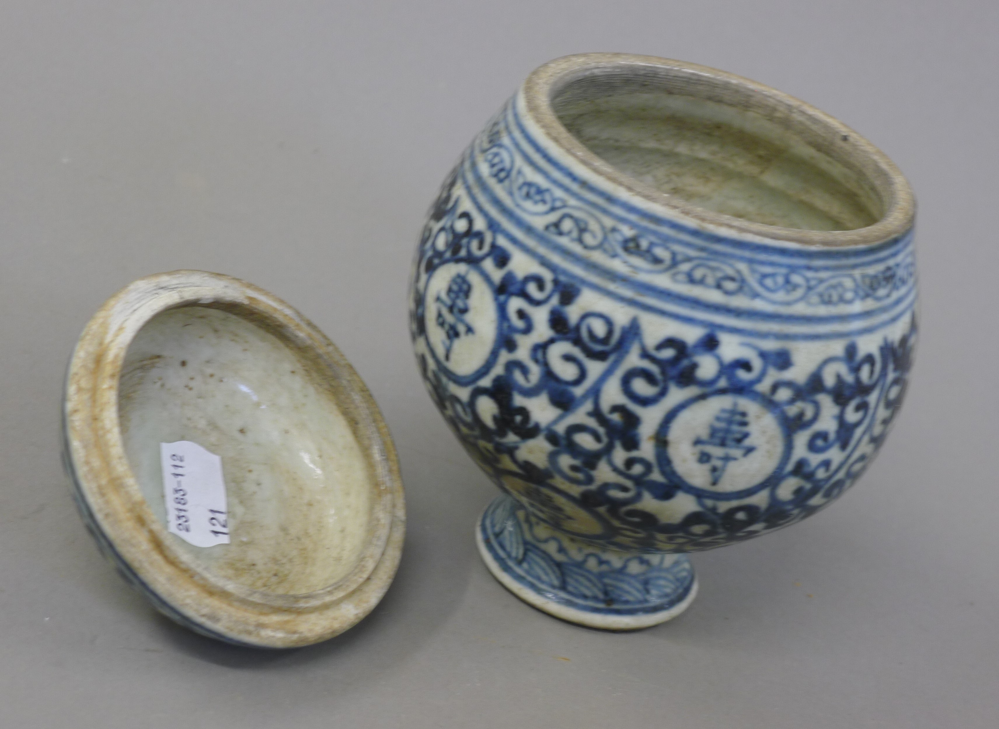 A Chinese blue and white pottery lidded pot with calligraphy. 15 cm high. - Image 3 of 3