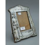 An Art Nouveau silver plated photograph frame,