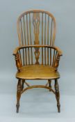 A yew wood and elm Windsor chair. 56 cm wide.