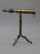 A telescope on stand. 23.5 cm long.