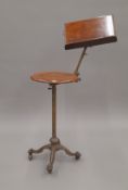 A Victorian telescopic walnut mounted reading stand.