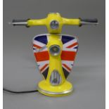 A vespa form lamp. 32 cm high.