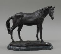A bronze model of a horse. 22.5 cm high.
