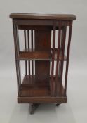 A Victorian rosewood revolving bookcase. 46.5 cm wide.