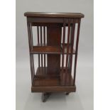 A Victorian rosewood revolving bookcase. 46.5 cm wide.