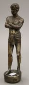 A silvered copper model of a semi clothed male. 28.5 cm high.