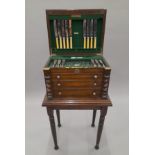 An early 20th century oak cutlery canteen cabinet.