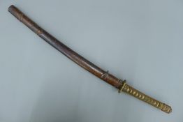 An early 20th century Japanese Katana sword, in leather scabbard. 98 cm long overall.
