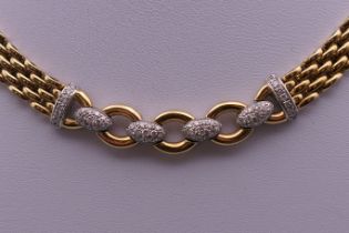 An 18 ct gold diamond necklace. 42 cm long. 68.2 grammes total weight.