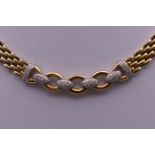 An 18 ct gold diamond necklace. 42 cm long. 68.2 grammes total weight.