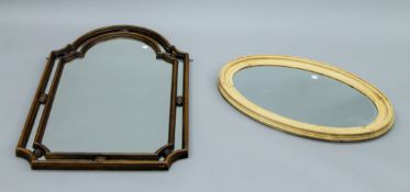 An oval framed mirror and another mirror. The latter 107 cm high.