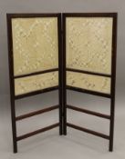 An Art Nouveau tapestry inset folding screen. 114 cm high.