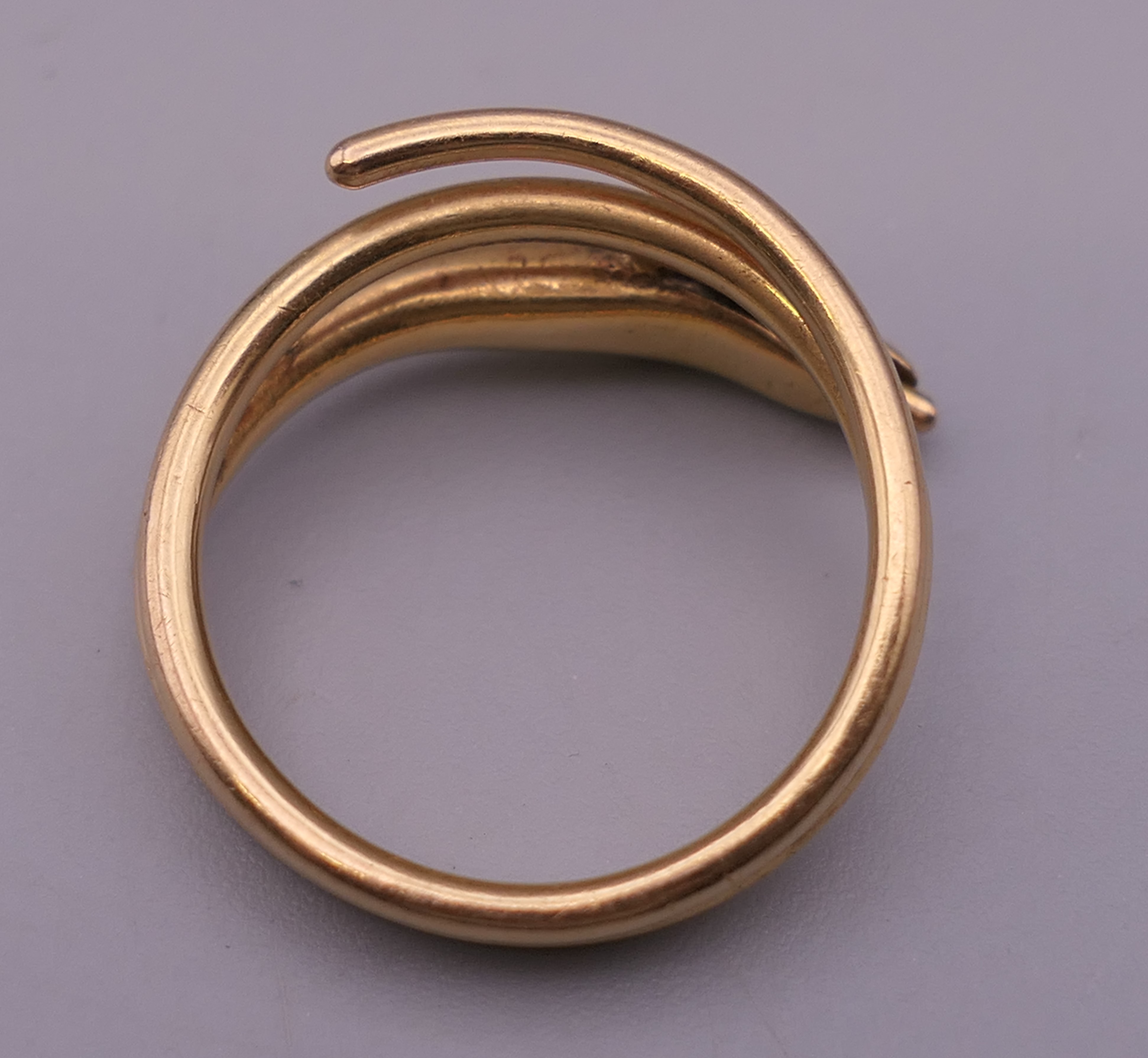 An 18 ct gold snake form ring. Ring size J/K. 5.5 grammes total weight. - Image 3 of 4