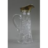 A silver top cut glass jug. 26.5 cm high.