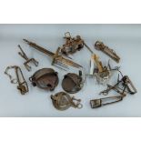 A collection of antique animal traps and snares, etc.