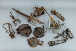 A collection of antique animal traps and snares, etc.