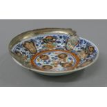 An 18th/19th century silver handled Imari dish. 24.5 cm diameter.