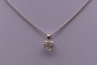 An 18 ct white gold diamond pendant, the heart shaped diamond approximately 1.