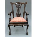 An 18th century style doll's chair. 50.5 cm high.