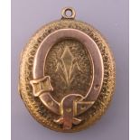 A Victorian unmarked locket. 3 cm high.