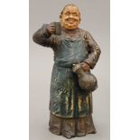 A 19th century painted terracotta model of a jolly monk. 26 cm high.