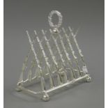 A silver plated rifle form toast rack. 20 cm long.