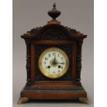 A Victorian walnut mantle clock. 36 cm high.