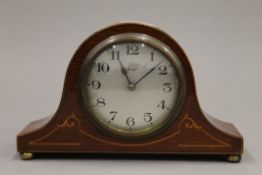 An Edwardian inlaid mahogany mantle clock. 21 cm wide.