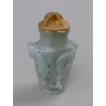 A small jade vase with wooden top surmounted with a frog. 10.5 cm high.