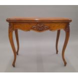 A Victorian burr walnut card table. 86 cm wide.