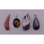 Four mineral specimen pendants. The largest 4.5 cm high.