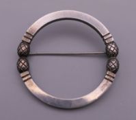 A Georg Jensen silver circular brooch. 3.75 cm diameter.