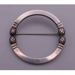 A Georg Jensen silver circular brooch. 3.75 cm diameter.