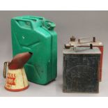 A Shell Oil can and petrol cans.