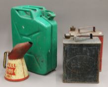 A Shell Oil can and petrol cans.