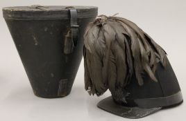 A late 19th/early 20th century military shako with feathers and London rifle brigade cap badge,